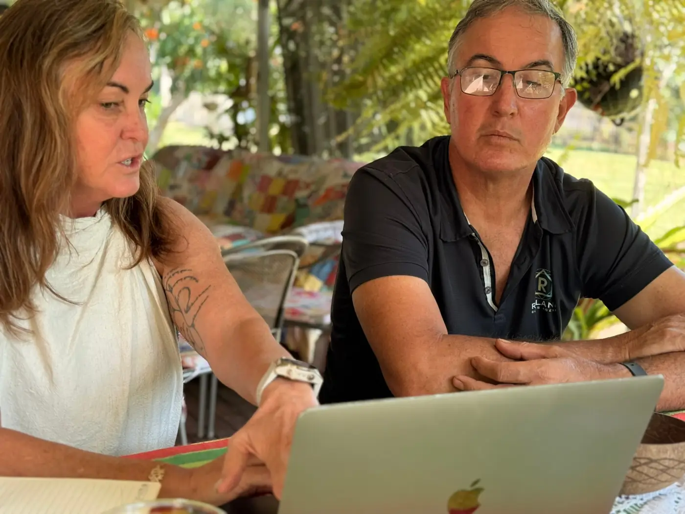 A business owner walking through their marketing plan on a laptop